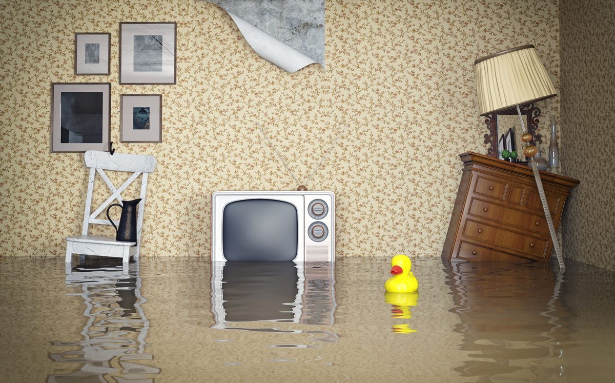 A staged image of house furniture submerged in water, signifying a flooded house.
