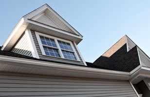 Close up of a dormer with windows in it.