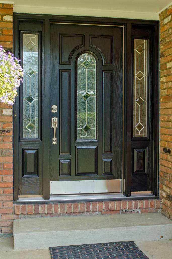 Black entry door with arched glass and matching sidelites