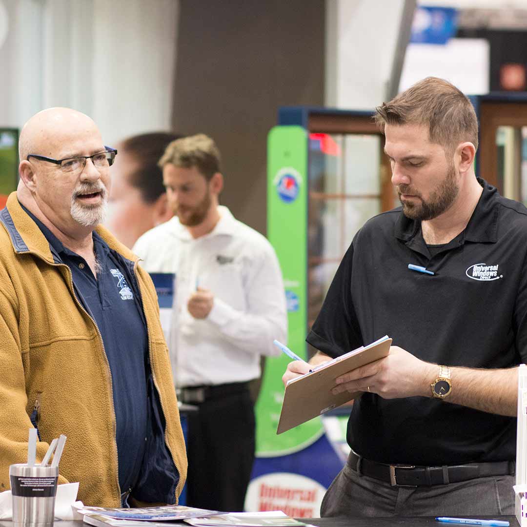 UWD Marketer Explaining our Process to Customer UWD marketer explaining purchase process to customer at Home and Garden Show