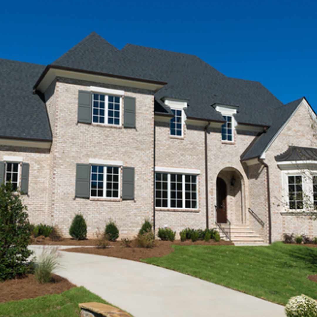 Large Brick House large brick house with grey shutters
