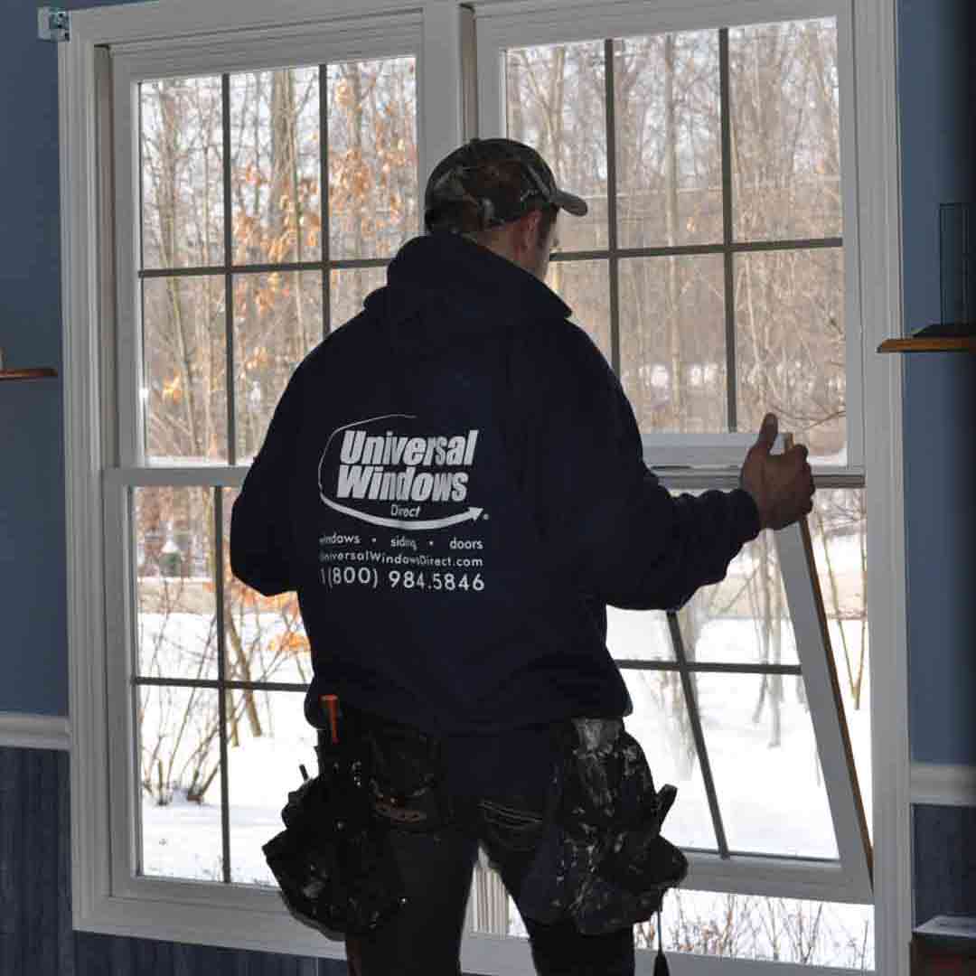 UWD installer installing bottom window sash