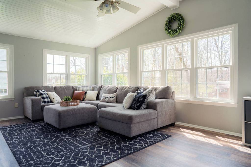 Sunroom lined with double-hung windows