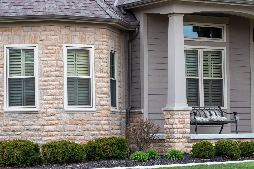A close up of windows installed by Universal Windows Direct on the front of a house.