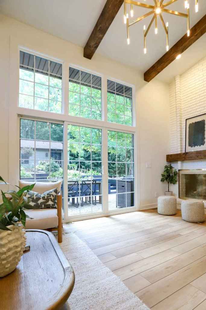 White, gridded windows surround a white gridded sliding patio door, installed by Universal Windows Direct.