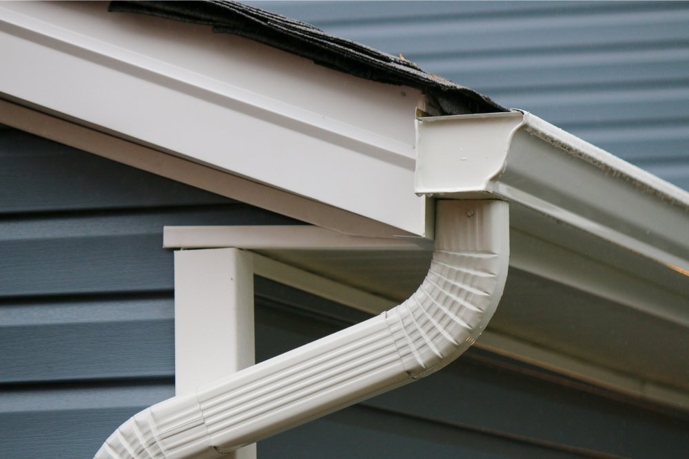 Side view of a gutter end cap and gutter elbow installed by Universal Windows Direct.