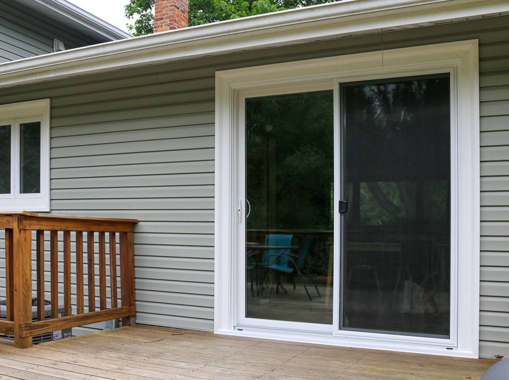 Sliding patio door opening onto a wood deck