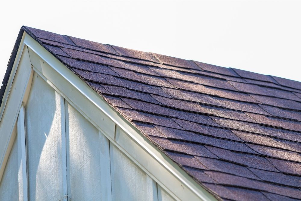 Red roof shingles installed by Universal Windows Direct.