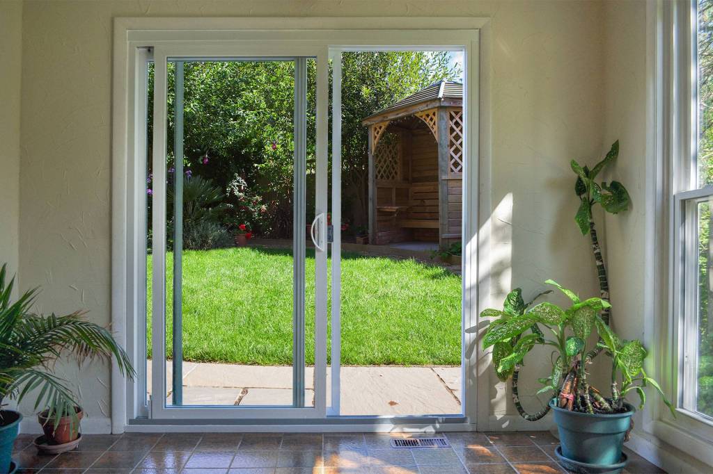 Sliding glass door with a view of the backyard