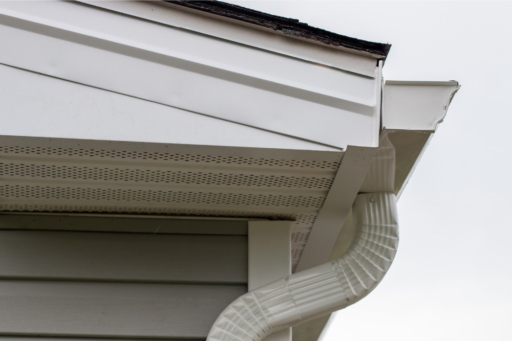 Side view of a gutter end cap and gutter elbow installed by Universal Windows Direct.