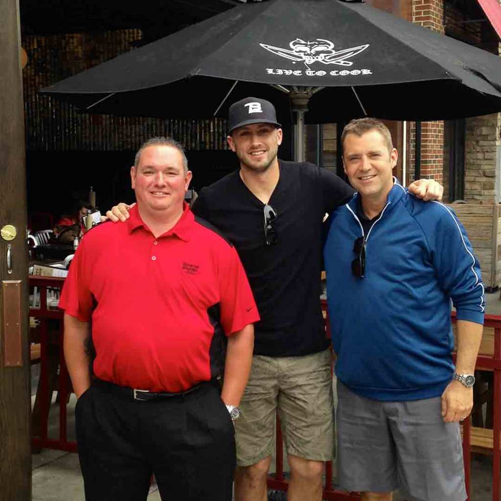 Browns quarterback Brian Hoyer with two Universal Windows Direct staff members outside a restaurant