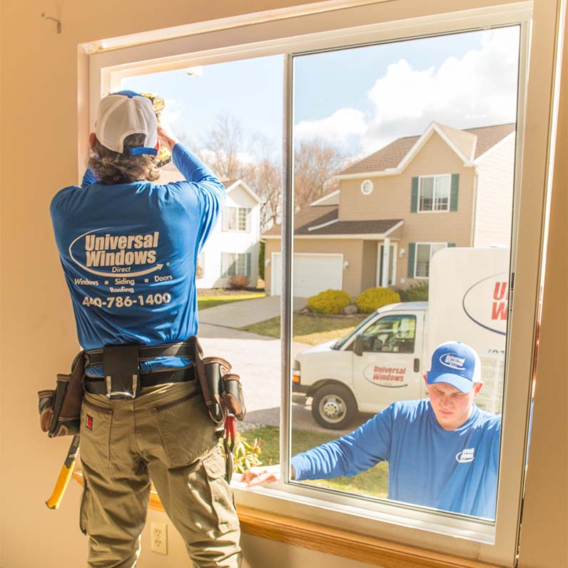A window technician installing a new window